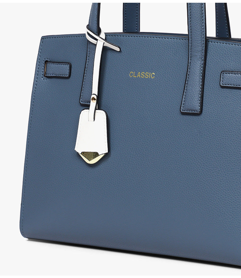 女性のハンドバッグ大容量ショルダーバッグ高級感牛革通勤OL何とでも合うシンプルハンドバッグ.カバン