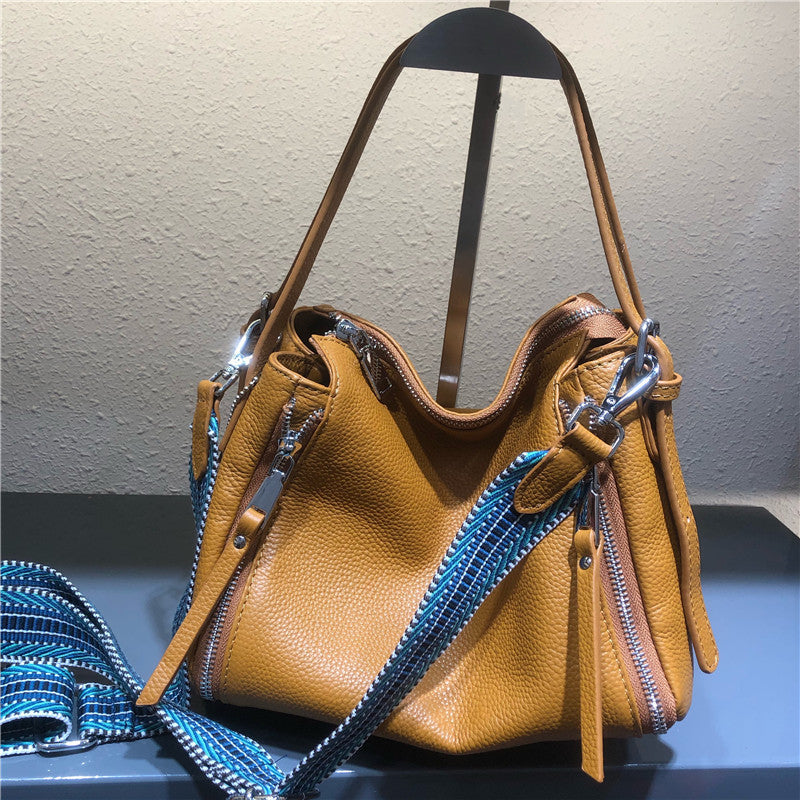 牛革カジュアル女性用バッグソフト牛革ロングラインバッグライチ柄ジッパー暗袋ハンドバッグ